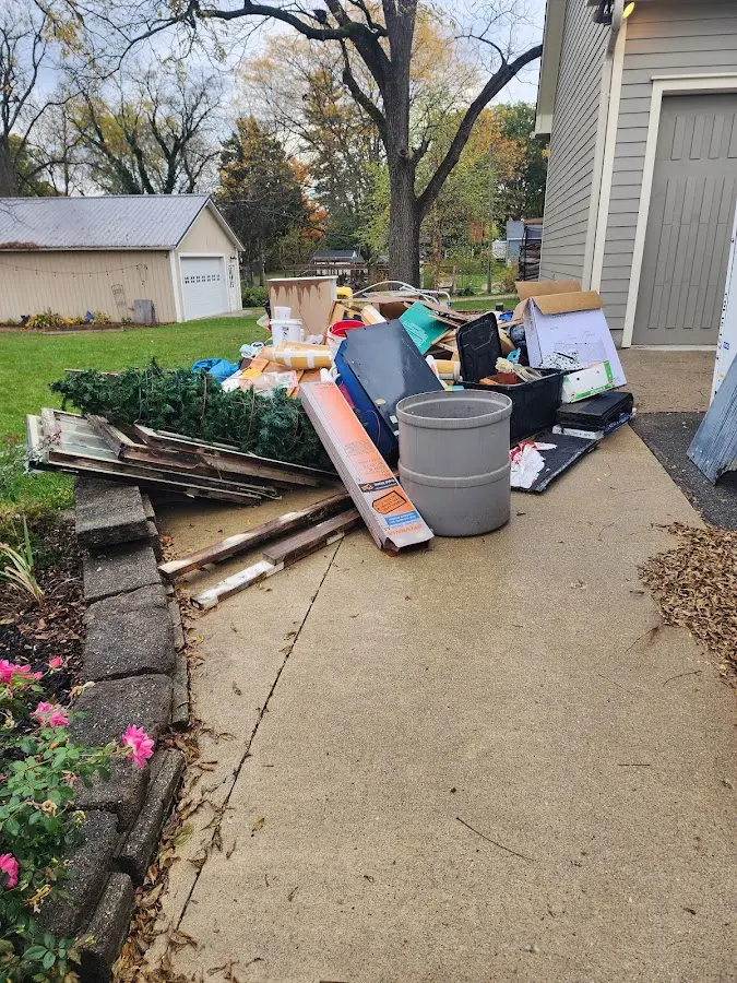 Dumpster being loaded with debris for Commercial Dumpster Rental in Gaines